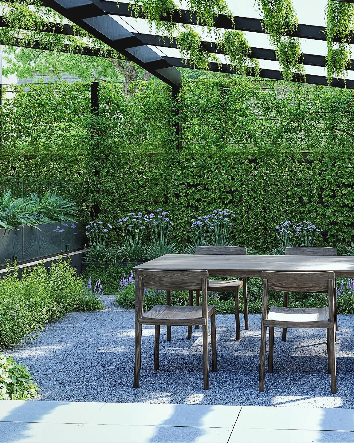 Completed garden with layered planting, pergola and outdoor dining area