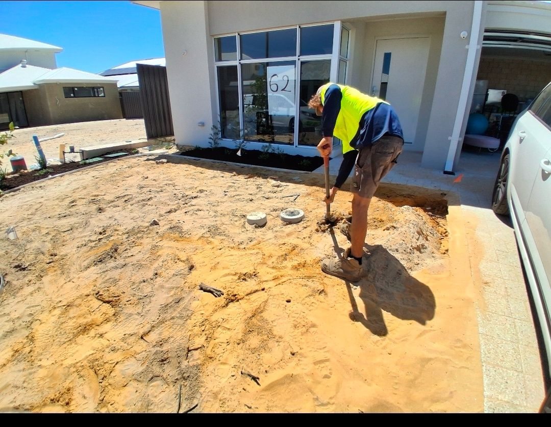 Landscape ground preparation underway at a new home
